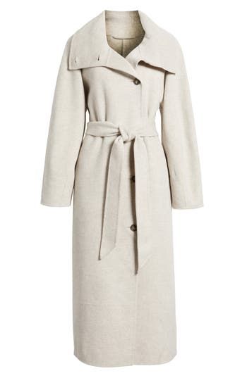 A novel collar style allows this wool-blend coat to provide two cold-weather looks on one hanger. Buttoning the collar all they way up provides neck-warming coziness, while leaving it unbuttoned serves showy shawl-collar style. Front button closure Convertible funnel neck Front welt pockets Removable sash Lined 80% wool, 20% polyamide Dry clean Imported Winter Beige Outerwear With Spread Collar, Cream Wool Coat With Button Closure For Fall, Cream Outerwear With Padded Collar For Work, Collared Sweater Coat For Work In Winter, Collared Wool Coat For Fall, Cream Wool Coat For Fall Workwear, Spread Collar Outerwear For Winter Office Wear, Spread Collar Outerwear For Office In Winter, Winter Office Outerwear With Spread Collar