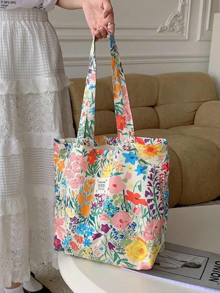 This spacious canvas shoulder bag is the perfect companion for a day at the beach or a shopping spree. With its large capacity and charming summer floral design, it effortlessly combines fashion and functionality. Stay organized and stylish with this must-have accessory. Color : Multicolor Bag Size : Large Type : Shoulder Tote Bag Pattern Type : Geometric Pattern Type : Graphic Pattern Type : Tropical Pattern Type : Plants Material : Polyester Composition : 100% Polyester Size Bag Height Bag Length Bag Width Handle Height one-size 34 44 15 28 Canvas Shopper Bag, Plant Bags, Diy Bags Purses, Beach Trips, Floral Canvas, Stylish Shoulder Bag, Tote Bag Pattern, Shopping Tote Bag, Canvas Shoulder Bag