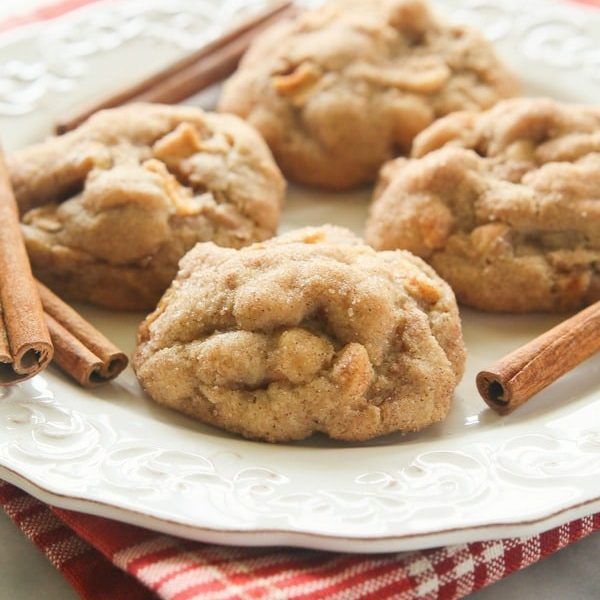 cinnamon cookies on a plate with cinnamon sticks