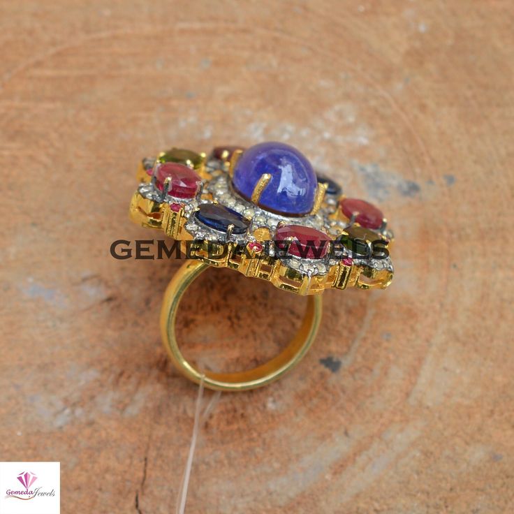 Tanzanite Gemstone Ring, Ruby Gemstone Ring, Sapphire Gemstone Ring, Pave Diamond Jewelry, 925 Silver Jewelry, Gold Vermeil Jewelry, Gifts Gross Weight: 16.34 gram Diamond Weight: 1.20 cts Gemstone Weight: 16.85 cts Ring Size: 38X34 MM NOTE:- All The Products Are Designed And Manufactured In My Workshop By Me & My Team. Shown Products Are Purely Handmade. Custom Orders Are Open Handly Accepted. We Are the Perfect Choice For Any Custom Jewelry Manufacturing. For Bulk Orders Please Message me. Multicolor Round Diamond Ring For Gift, Multicolor Round Diamond Ring Gift, Multicolor Diamond Ring As Gift, Elegant Multicolor Amethyst Ring, Unique Round Gemstones With Stone Setting, Fusion Style Oval Jewelry With Stone Setting, Exquisite Oval Rings With Stone Setting, Exquisite Oval Stone Setting Rings, Oval Fusion Jewelry With Stone Setting