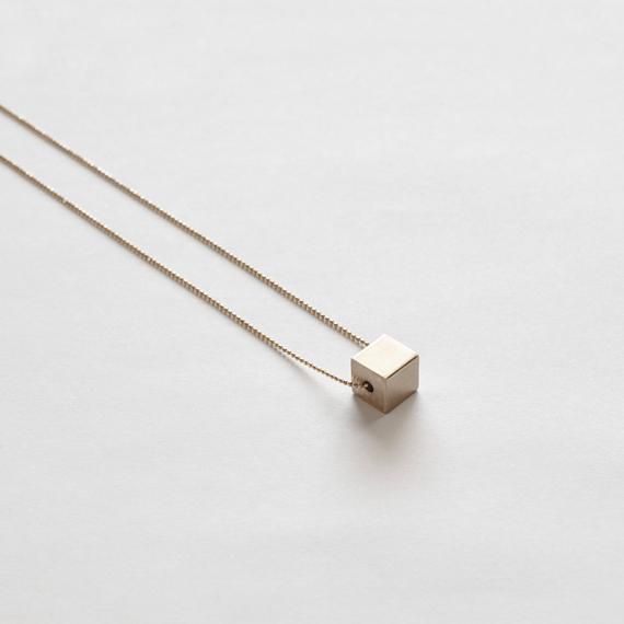 ◒ KLAR - Solid brass cube necklaceDETAILS AND FINISHINGS▴ Each piece is handmade.  Please expect slight variations between each item and the photograph in the listing.▴ Raw brass pendant is polished with a protective wax.▴ Chain is 24K gold plated brass.DIMENSIONS▴ Pendant Dimensions:  3/8"▴ Chain Length: 30"▴ Chain thickness: 1mm ball chainCARE▴ By nature, all brass will eventually darken over time but can be maintained and polished back to its original shine with a simple smooth buffing pad or Minimalist Box Chain Jewelry For Jewelry Making, Minimalist Rectangular Box Chain Jewelry, Minimalist Jewelry With Delicate Square Pendant, Minimalist Jewelry With Delicate Chain And Square Pendant, Minimalist Long Box Chain Necklace, Minimalist Box Chain Jewelry As Gift, Simple Rectangular Necklace For Gift, Minimalist Square Pendant For Jewelry Making, Square Minimalist Jewelry For Everyday