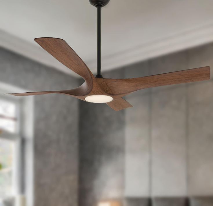 a ceiling fan with wooden blades in a living room