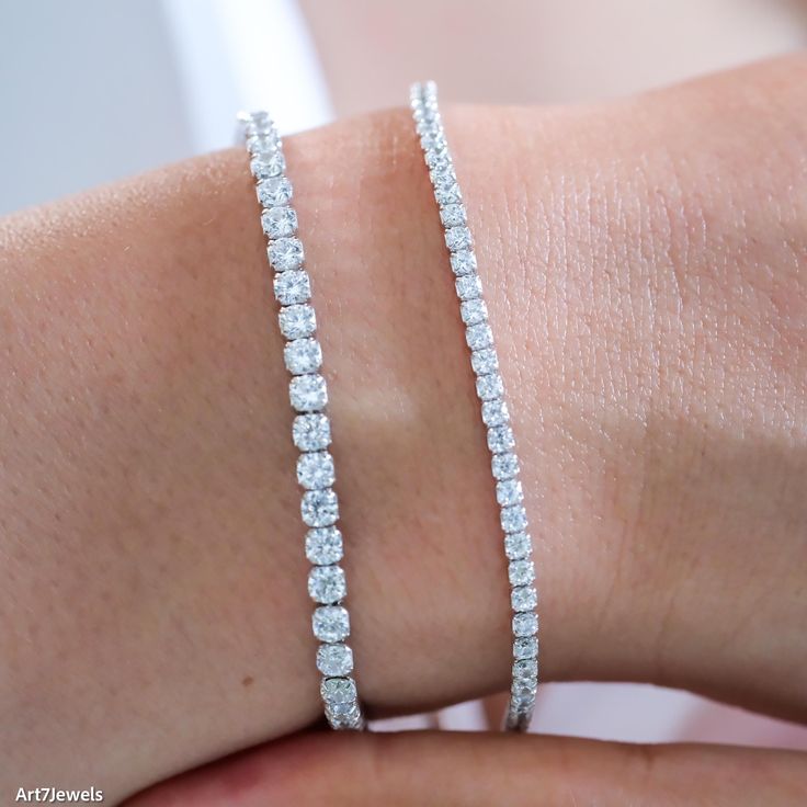 This exquisite dainty diamond CZ tennis bracelet features shimmering 2mm and 3mm cubic zirconia stones, offering the brilliance of diamonds at an accessible price. Crafted in a sleek, minimalist design, the bracelet exudes elegance and simplicity, making it perfect for everyday wear or special occasions. Its delicate yet durable construction ensures a comfortable fit and timeless appeal. Ideal as a birthday gift, anniversary present, or a thoughtful surprise for someone special, this minimalist white tennis bracelet is a must-have addition to any jewelry collection. DETAILED DESCRIPTION// Material: 925 sterling silver  Stone:  White diamond cz  Size of stone: 2mm, 3mm Length: 16+5 cm adjustable (6.3 inches + 2 inches)  Weight: 3.64g (2mm), 5,76g (3mm) //OUR COMMITMENT: WHAT YOU SEE IS EXAC Adjustable Diamond Cut Cubic Zirconia Tennis Bracelet, Adjustable Tennis Bracelet With Vvs Clarity, Adjustable Vvs Clarity Tennis Bracelet, Adjustable Diamond Cut Tennis Bracelet, Diamond White Bracelet With Sparkling Round Cut Stones, Adjustable Brilliant Cut Tennis Bracelet, Adjustable Tennis Bracelet With Brilliant Cut, Adjustable Brilliant Cut Round Tennis Bracelet, Adjustable Diamond White Tennis Bracelet