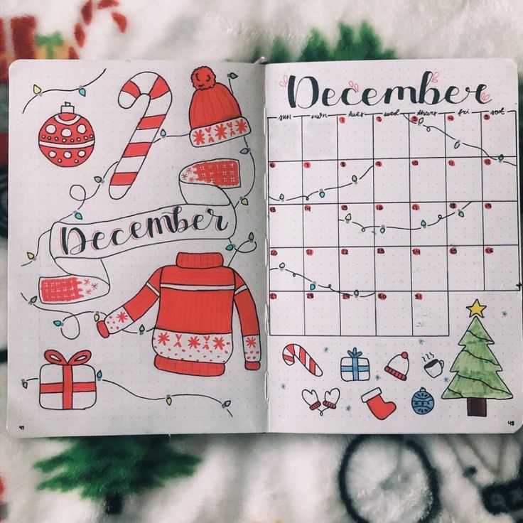 an open christmas planner on top of a blanket