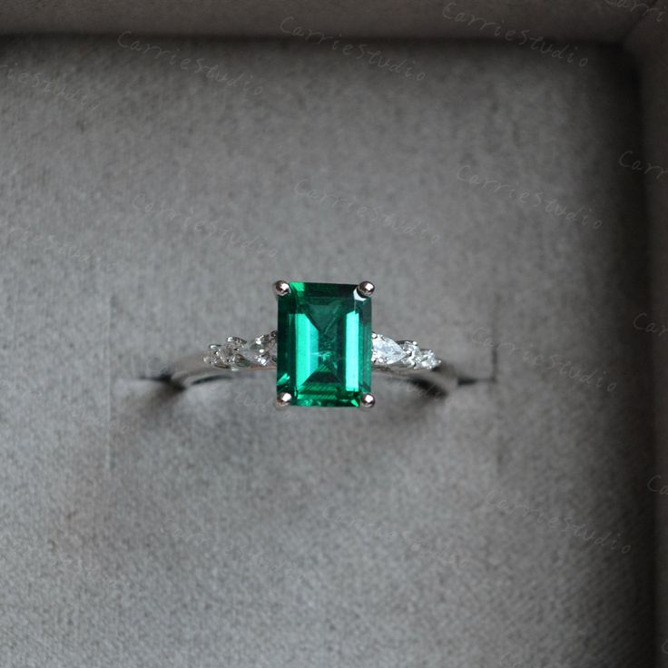 Breathtaking minimalist style green emerald ring, with a 1.2ct emerald in the middle, with a pear stone and two round stone on each side, simple but elegant design, can also wear with different bands, to make a unique match, beautiful and special gift for someone you loved or for yourself, we all worth beautiful items. ❥Details: Material: Solid 14K Gold Main Stone: 1.25ct Lab Created Emerald Cut: Emerald Side Stone: CZ/Moissanite CSG076 See other gold items in our shop: https://www.etsy.com/shop Green Emerald Jewelry For Proposal, Elegant Green Pear-shaped Rings, Green Emerald Ring With Prong Setting In Pear Shape, Green Emerald Ring With Accent Stones For May Birthstone, White Gold Emerald Promise Ring, White Gold Emerald Ring For Proposal, Green Emerald Birthstone Ring With Center Stone, Pear-shaped Green Emerald Ring With Prong Setting, Proposal White Gold Emerald Ring