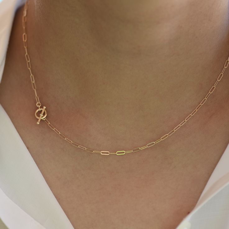 "14K Toggle Necklace, Gold Paper Clip Chain, Delicate Necklace Gold Choker. 14K gold Long Link Chain This necklace can be worn by itself or with other necklaces. *The chain, toggle clasp and all components are 14K solid yellow gold (If you order a 16\" necklace, it will be a toggle clasp plus chain will be 16\".) *The toggle clasp is about 3/8\" The model in the picture wears a 16\" necklace. Please read our policies before you place your order. https://www.etsy.com/shop/SashJewelry/policy?ref=s Minimalist Yellow Gold Toggle Necklace For Everyday, Gold Minimalist Toggle Necklace With Paperclip Chain, Minimalist Gold Toggle Necklace With Paperclip Chain, Gold Minimalist Toggle Necklace With Cable Chain, Minimalist Oval Link Toggle Necklace With Cable Chain, Minimalist Toggle Necklace With Oval Link Cable Chain, Elegant Yellow Gold Chain Link Toggle Necklace, Classic Yellow Gold Link Toggle Necklace, Gold Dainty Toggle Necklace For Everyday