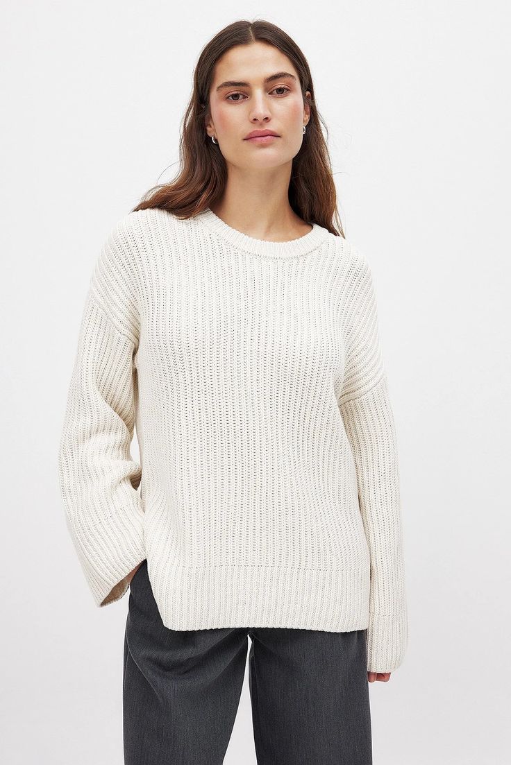 Round Neck Knitted Sweater Offwhite | NA-KD White Ribbed Knit Sweater, White Knit Sweater With Ribbed Neckline, White Ribbed Knit Top For Fall, White Knit Cropped Sweater With Ribbed Cuffs, Fall Winter White Sweater With Ribbed Neckline, Fall Classic Sweater With Ribbed Neckline In Winter White, Cream Ribbed Knit Sweater, Ribbed Crew Neck White Sweater, Oversized Cream Ribbed Sweater