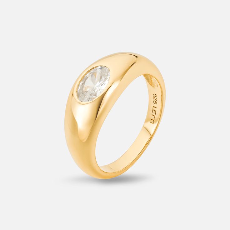 Step up your style game with the Ona Statement Ring! This signet ring design with its single pave stone makes for an effortlessly chic look. Be bold and make a statement - your fashion-forward look awaits. Details: Gold: 925 Sterling Silver, 18K Gold Plated, AAAAA Cubic Zirconia Silver: 925 Sterling Silver, Rhodium Plated, AAAAA Cubic Zirconia Width: 8mm Signet Ring Design, Gold Statement Ring, Onyx Earrings, Selling Jewelry, Cz Stone, Be Bold, Signet Ring, Gold Plated Jewelry, Jewelry Plate