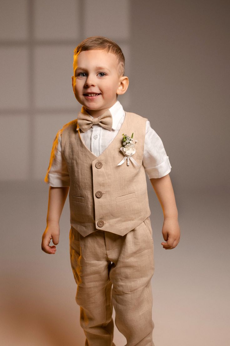 Linen ring bearer outfit: pants, vest, suspenders, bow tie and shirt. Ring Barrer, Boho Ring Bearer, Ring Bearer Suit, Cream Outfit, Vacation Dresses Beach, Tan Suit, Bearer Outfit, Baptism Outfit, Ring Bearer Outfit