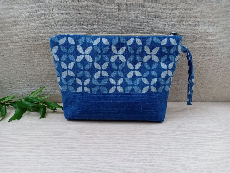 Boho Handmade Makeup Pouch Color: Blue and White Notes: The patterns on the pouch are not exactly the same due to the cut of the fabric. We will choose the pattern randomly for you, or if you want to select specifically, please send us a message !! Details: - The front and back of the pouch are made of cotton, dyed naturally into this indigo blue color. The tribal patterns are printed using block printing technique. - The size of the pouch makes it convenient for you to store makeups or small st Blue Zipper Pouch For Daily Use, Blue Cosmetic Pouch Bag For Personal Use, Blue Portable Pouch Cosmetic Bag, Everyday Blue Pouch With Zipper, Everyday Blue Zipper Pouch, Portable Blue Pouch Cosmetic Bag, Blue Zipper Pouch, Handmade Blue Rectangular Pouch, Blue Rectangular Pouch For Personal Use