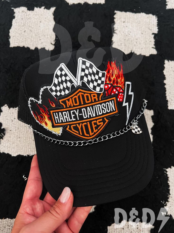 This custom made trucker patch hat is perfect for any occasion whether it be for spring/summer time, a lake hat, a gift for someone, or just a cute accessory to add a little spice to your outfit 🧢✨ DETAILS-  * This hat is one size with an adjustable SnapBack that is adjustable from 20in. - 23.5in. * The color of this hat is Black * The material of the hat is polyester with iron on patches  REFUNDS AND CANCELLATIONS- Every hat is handmade by me as a result, a slight variation can occur from the picture with patch size or placement. If you have any problems with your hat please message me within 24 hours of receiving your order and I'd be happy to help! No refunds or exchanges will be accepted after. NOTICE OF NON-AFFILIATION AND DISCLAIMER: We are not affiliated, associated, authorized, en Biker Cap For Outdoor Use, Biker Cap For Outdoor, Biker Style Cap For Outdoor, Outdoor Biker Cap, Trucker Cap Mini Hat, Trucker Cap Mini Hat One Size, Festival Trucker Baseball Cap With Curved Brim, Trucker Mini Hat One Size, Fun Black Trucker Hat For Outdoor