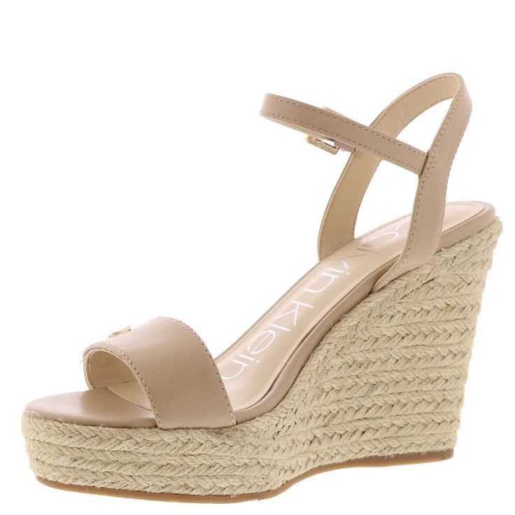 PRICES MAY VARY. A warm weather essential, the Calvin Klein Hamal wedge sandal is a must have. The classic espadrille silhouette features clean lines and an oversized Calvin Klein monogram on the upper strap. Founded in New York in 1968, the brand elevates everyday essentials to globally iconic status. Round Toe Buckle Closure Imported Modern Wedge Sandals For Spring, Spring High Heel Natural Wedge Sandals, Natural Color Wedge Heel Sandals For Spring, Natural Color Spring Wedge Sandals, Spring Natural Color Wedge Sandals, Modern Wedge Sandals For Spring Vacation, Modern Ankle Strap Wedge Sandals For Beach, Natural Wedge Sandals With Cushioned Footbed For Spring, Spring Beige Espadrille Wedge Sandals