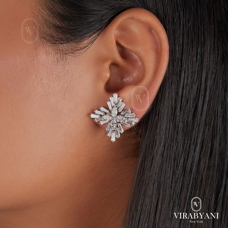 Sparkle and shine with these stunning 4.05 ct marquise and tapered baguette diamond earrings. The unique snowflake pattern, created by four marquise diamonds surrounded by tapered baguettes, will add a touch of elegance to any outfit.  EARRINGS INFORMATION: * Metal Type: 14K White Gold * Metal Weight: 7.4gr DIAMOND INFORMATION: * Type: Lab-Grown Diamond * Diamond Shapes: Marquise, Tapered Baguettes * Carat Total Weight: 4.05 ct. * Stone Sizes: Marquise- 5.2x 2.8 mm, Tapered Baguettes-4*2mm * Sto Baguette Diamond Earrings, Snowflake Pattern, Marquise Diamond, Gold Floral, Baguette Diamond, Diamond Clarity, Jewelry Earrings Studs, Diamond Shapes, Lab Grown