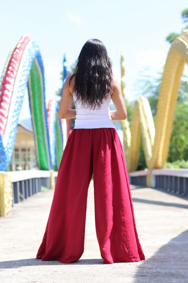 All items are shipped Thailand Post. Free upgrade when you buy 2 items or more.The USA only. Please leave a phone number with orders . Made in 100% cotton soft , light and very comfy . These bell bottom pants have a cute design .They allow you to adjust the bottom of the hemline with 4 ties on the inside of the leg .Tighten the ties to create a draped look , tie loosely for a bell bottom hemline . Fantastic flare of 50''inches . The pants are half lined with an elastic waist band .They flare out Red Wide Leg Cargo Pants, Red Cotton Wide Leg Pants With Loosely Fitted Hips, Red Wide Leg Cotton Pants, Red Stretch Cotton Harem Pants, Red Stretch Wide Leg Harem Pants, Red Wide Leg Cotton Harem Pants, Red Cotton Full-length Harem Pants, Full Length Red Cotton Harem Pants, Red Full-length Cotton Harem Pants