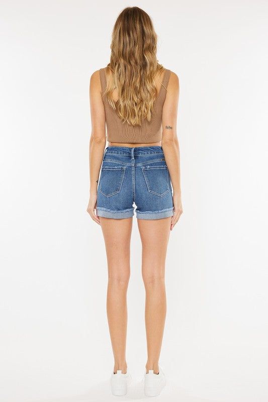 KanCan USA Jasmine High Rise Single Fold Shorts Light and medium-washed denim shorts with single fold hem design for a trendy summer look. Our Jasmine High Rise Shorts sit above the natural waistline for a comfortable fit that will give you a flattering silhouette as it contours to your body. Made with super-stretch, breathable denim that lets you move with ease while maintaining its shape. Features a classic five-pocket design, single-button front with zip-fly closure, finished with gold-colore Summer Jeans With Rolled Hem In Medium Wash, Spring Mid-rise Bottoms With Rolled Hem, Casual High Waist Jean Shorts With Rolled Hem, Casual Summer Shorts With Rolled Hem, Spring High-waisted Dark Wash Jean Shorts, Summer High Waist Dark Wash Shorts, Summer Medium Wash Jean Shorts With Rolled Hem, High Rise Rolled Hem Summer Jeans, Spring Jean Shorts With Rolled Hem In Medium Wash