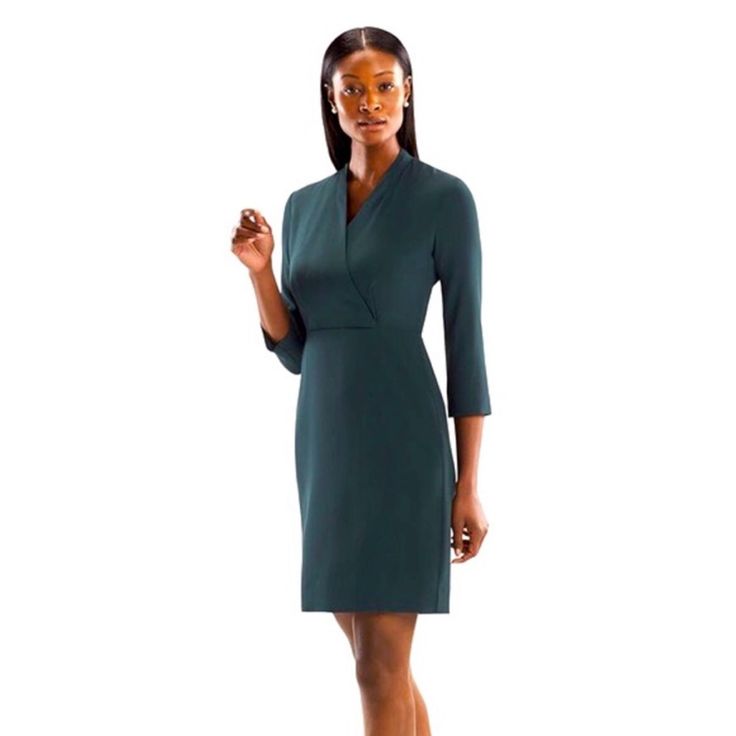 For The Niko, We Took Everything We Love About The Traditional Wrap Dress (An Elegantly Folded Front Panel, Defined Waist, And Relaxed Sleeve) And Updated It In Our Machine-Washable Sharkskin Fabric Sourced From Italy. Beautiful Professional Dress. Fit: Tailored Body Type: Bust-Friendly, Petite-Friendly Sleeve Length: 3/4 Sleeve Neckline: V-Neck Bottom Shape: Pencil Bottom Length: Knee Mm Lafleur Faux Wrap, Knee Length, 3/4 Sleeve, Sheath Dress Deep Forest Green Size 2 82% Triacetate, 18% Polyes Fitted Green V-neck Dress For Work, Elegant Green Dress With 3/4 Sleeves, Elegant Workwear Dress, 3/4 Length, Elegant 3/4 Length Workwear Dresses, Elegant 3/4 Length Work Dress, Elegant 3/4 Length Dress For Work, Fitted Wrap Dress With 3/4 Sleeves For Spring, Fitted Wrap Dress With 3/4 Sleeves, Fitted Midi Dress With Half Sleeve For Work