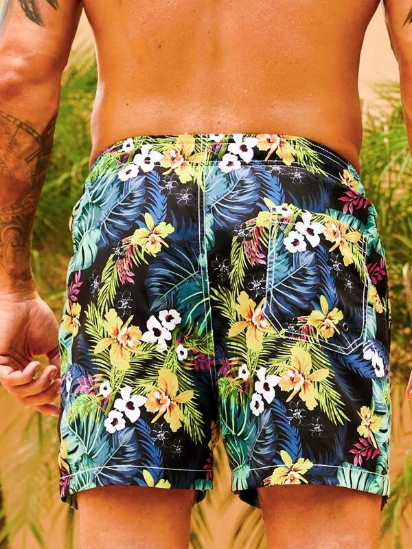 Get ready to embrace the tropical paradise with our Flower Tropical Print Swim Trunks. These swim trunks feature a vibrant and captivating floral print that instantly transports you to a beach getaway. The drawstring waist ensures a comfortable and adjustable fit, allowing you to enjoy your time in the water with ease. Specifications: Pattern Type: Tropical, All Over Print Details: Drawstring, Pocket Type: Bottoms Bottom Type: Shorts Fabric: Non-Stretch Composition: 100% Polyester Care Instructi Hawaiian Swim Trunks For Poolside Vacation, Hawaiian Style Swim Trunks For Summer Beach Party, Hawaiian Style Shorts For Pool Vacation, Tropical Swim Trunks For Summer, Summer Tropical Print Swim Trunks For Poolside, Tropical Print Swim Trunks For Poolside Summer, Tropical Swim Trunks For Vacation, Multicolor Hawaiian Summer Bottoms, Tropical Short Swim Trunks For Summer