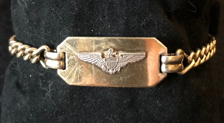 "Precious WWII sweetheart bracelet from the 1940's.   This awesome bracelet is packed with whispers of memories, in excellent vintage condition -- ready to adorn the wrist of your beloved, just like in the old days.  Bracelet is 7\" long and 1/2\" wide. This listing is offered as-is. Please ask ask all questions before purchasing." Vintage Engraved Yellow Gold Bracelet, Vintage Yellow Gold Engraved Bracelet, Vintage Gold Jubilee Cuff Bracelet, Vintage Gold Cuff Bracelet With Jubilee Design, Vintage Yellow Gold Hallmarked Cuff Bracelet, Vintage 14k Gold Bracelet For Anniversary, Vintage Gold Engraved Bracelets, Vintage Yellow Gold Bracelets Stamped 14k, Vintage Engraved Yellow Gold Cuff Bracelet