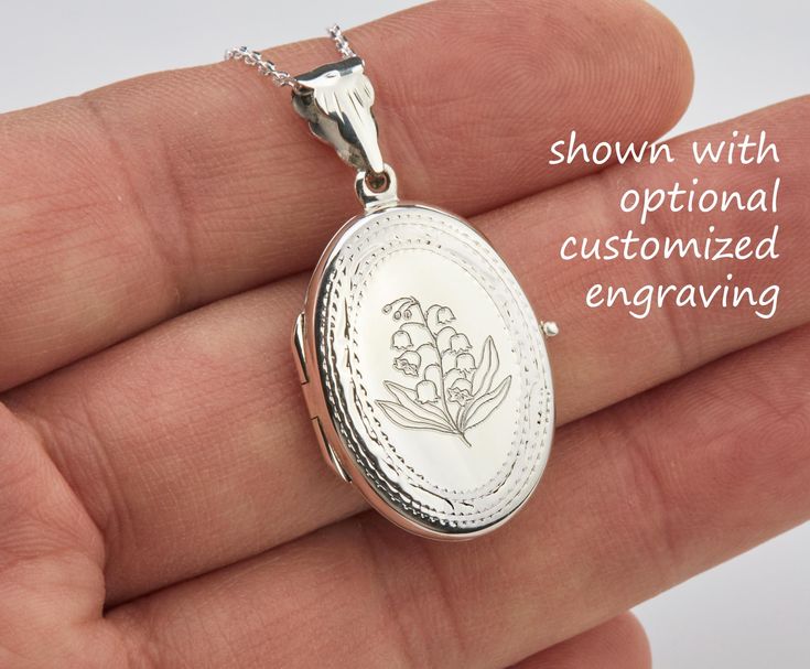 Also available in gold plated/rose gold plated over sterling silver. This elegant customized oval locket will help you keep the memories of your loved ones afresh: 1. One shining, highly polished sterling silver locket. (19 x 26 mm, about the size of a quarter, 4.6 grams). Its front has an etched decorative border. Its back is plain. Both sides can be custom engraved with initial, text or simple graphics.  2. There are two photo slots. Photo insertion service is available for $14 each photo (pricing reflected in your pulldown option. If you select " ... 1/2 photo", please send your locket photos by attaching them to an ETSY conversation to me. 3. a sterling silver or gold filled cross pendant     Upgrade is also available:     https://www.etsy.com/listing/736367470 4. an optional customize Oval Jewelry With Engraving Option For Memorial, Rose Gold Medallion Jewelry With Engraving Option, Silver Oval Jewelry For Personalized Gift, Oval White Gold Locket Necklace For Wedding, White Gold Oval Locket Necklace For Wedding, Elegant Oval Locket Necklace With Engraving Option, Personalized Silver Jewelry With Oval Link, Oval Locket Necklace With Engraving Option For Wedding, Oval Link Jewelry With Engraving Option For Gift