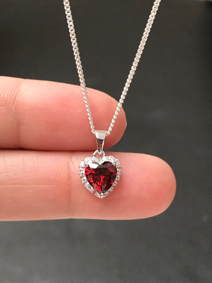 "Small Sterling Silver Garnet CZ Heart Necklace Garnet is the birthstone for January, this makes a great gift for those loved ones born January. Metal: All components are made from solid .925 Sterling Silver Stone: Cubic Zirconia Center Stone size: 7mm Center Stone Carat Weight: 1.6ct Measurement: pendant height is 14mm (0.55\") including bail and 10mm (0.39\") wide Choose Chain Length At Checkout Please feel free to Convo me with any questions before purchasing. Please view policy before purcha Garnet Snowflake Necklace, Valentine's Day Cubic Zirconia Jewelry With Heart Charm, May Birthstone Crystal Jewelry Gift, Crystal Jewelry For May Birthstone Gift, Crystal Jewelry Gift For May Birthstone, Crystal Necklaces For Mother's Day Gift, Crystal Jewelry Valentine's Day Gift For Her, Crystal Jewelry For Valentine's Day Gift, Crystal Jewelry For Valentine's Day Gift For Her