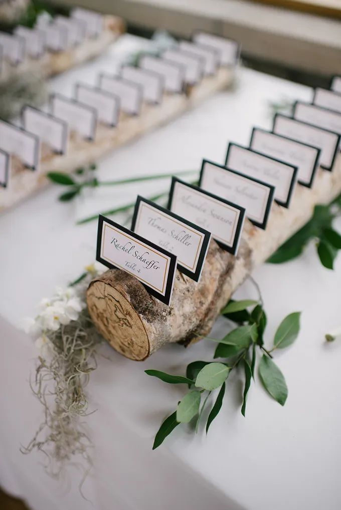 place cards are placed on top of a log