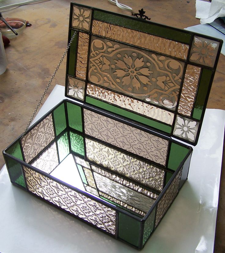 a stained glass box sitting on top of a table