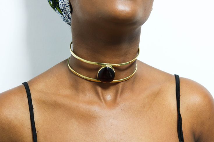 African Brass necklace, Brass Pendant Necklace, Brass jewelry, African jewelry for women, Christmas Gift for her, Moms gift The necklace is handcrafted using brass metal. Length: 5 inches Shipping fee is for the first item only, additional items ship for FREE. DHL Express shipping with 3-5 days delivery. To view our brass collection, click here: https://www.etsy.com/shop/NkoroiCrafts?ref=simple-shop-header-name&listing_id=1295061994&section_id=39639351 *Care instructions* Brass tarnishes with exposure to moisture and oxidation. To clean it, kindly use a lemon wedge. Squeeze the juice and polish along the surface with a clean cloth. Gold Spiritual Pendant Choker, Spiritual Gold Pendant Choker, Gold Spiritual Choker Jewelry, Spiritual Gold Choker Jewelry, Brass Choker Jewelry As Gift, Bohemian Jewel Choker As Gift, Adjustable Bronze Choker As A Gift, Bohemian Jeweled Choker As Gift, Bohemian Jeweled Choker Gift