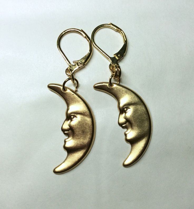 A fabulous pair of crescent moon earrings gold tone made in raw brass for pierced ears, a lovely man in the moon.  Great for the lover of the sky at night Raw brass is great, the look of 9ct gold without the price tag The charms are stamped metal and are single sided  See also other celestial earrings and other items from my range Measurement :   Moon 3cm long The charm is single sided Gold Half Moon Shaped Metal Jewelry, Metal Half Moon Earrings With Moon Charm, Half Moon Metal Earrings With Moon Charm, Half-moon Metal Earrings With Moon Charm, Half Moon Earrings With Moon Charm, Gold Moon-shaped Metal Hoop Earrings, Gold Moon Shaped Metal Hoop Earrings, Gold Crescent Earrings With Moon Phase Detail, Gold Moon Shaped Hoop Earrings