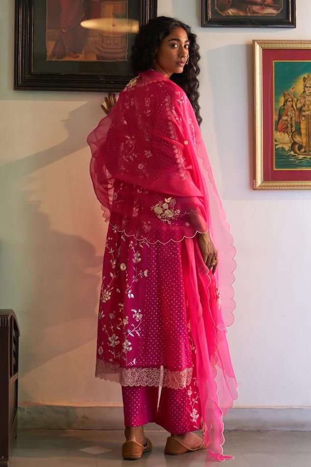 Neon pink kurta with resham embroidery and floral foil printed motifs. Paired with pant and dupatta.
Components: 3
Pattern: Embroidery, Foil Printed
Type Of Work: Resham, floral
Neckline: V neck
Sleeve Type: Bell sleeves
Fabric: Mangalgiri Cotton
Color: Pink
Other Details: 
Scallop bordered sheer dupatta
Length:
Anarkali: 46 inches
Pant: 38 inches
Approx. product weight: 1-3 kg
Model height: 5ft 7inches, wearing size M
Occasion: Sangeet - Aza Fashions Sheer Dupatta, Blouse Yoke, Resham Embroidery, Pink Kurta, Kurta Set For Women, Personal Shopping Service, Designer Label, Pattern Embroidery, Types Of Work