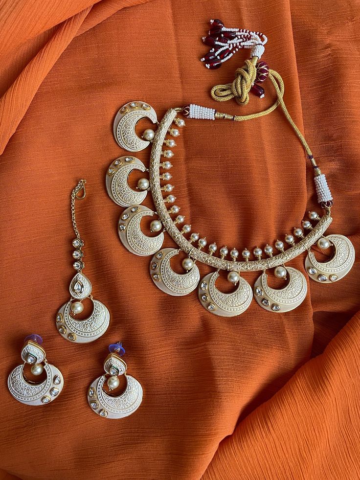 Gorgeous hasli style Rajasthani meenakari choker with kundan stones and matching earrings and tikka is the classiest piece of jewelry! This set is beautifully hand crafted and is very lightweight and versatile to wear! Cheap Meenakari Jewelry For Festive Season, Affordable Meenakari Jewelry For Puja, Luxury Meenakari Sets For Celebration, Luxury Spiritual Meenakari Necklace, Festive Meenakari Metal Jewelry Sets, Diwali Temple Jewelry Sets With Meenakari, Diwali Meenakari Temple Jewelry Sets, Temple Jewelry Sets With Kundan And Zari Work, Metal Chandbali Jewelry Sets For Diwali