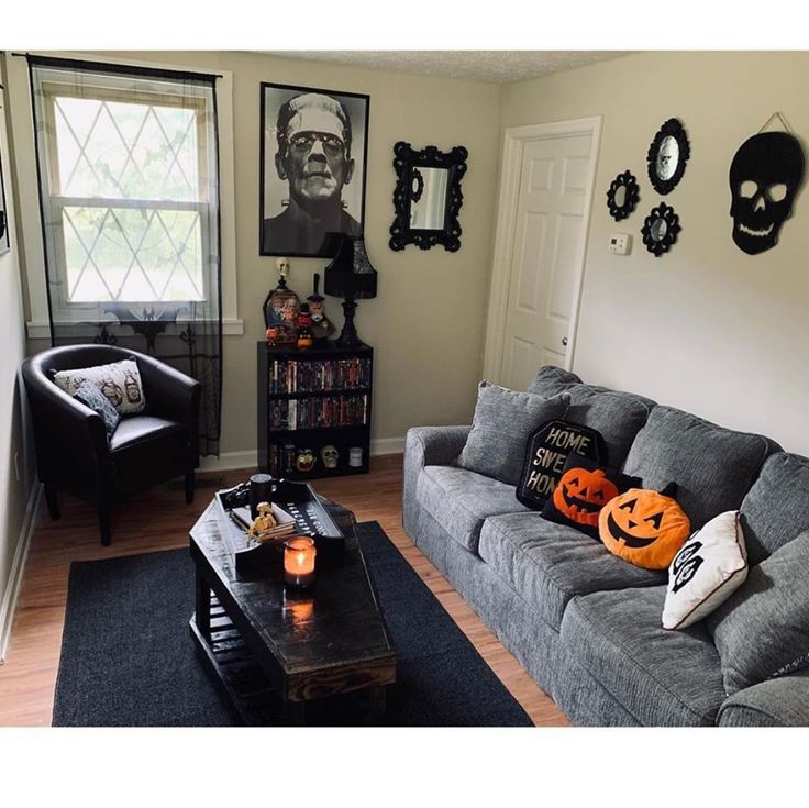 a living room filled with furniture and halloween decorations