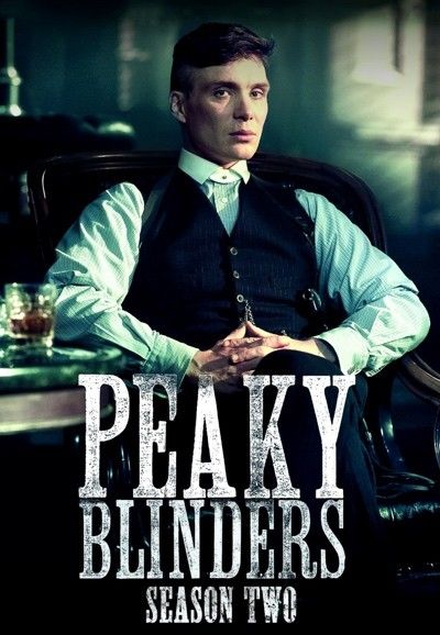 the poster for peaky blinds shows a man sitting in a chair with his hands on his hips