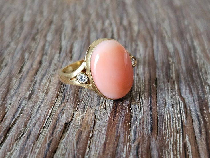 Pink coral ring set in 18 kt gold and diamonds. Ring size: 14,5 (Italian size) Coral piece size: 16×12mm Contact me for any other request | Customized works also available. The item will be shipped with a shop bag and box gift both with our brand Donadio on, as You can see in the main photos of the shop. We have FLAT RATE combined shipping for all our items to everyone everywhere. ✦ DonadioCameo Homepage www.etsy.com/shop/DonadioCameo ✦ Shop Policies www.etsy.com/shop/DonadioCameo/policy ✦ Visit Cameo Bracelet, Shop Bag, Cameo Jewelry, Coral Ring, Cameo Ring, Diamonds Ring, Cameo Necklace, Cameo Brooch, Cameo Pendant