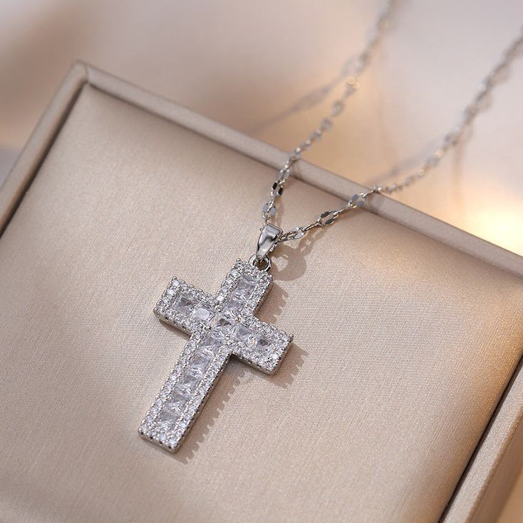 Description & Details Embrace the timeless symbol of faith, spirituality, and devotion with our exquisite pieces inspired by the sacred cross. Each design in our collection is meticulously crafted to honor the significance of the cross and serve as a beautiful reminder of one's beliefs and values. • Material: High Quality Titanium Steel ∙ Cubic Zirconia• Finish: Hypoallergenic ∙ Gold Plating• Dimensions: 40 - 45 cm chain, adjustable• All our work is custom made by hand with love Big Cross, Simple Cross, Timeless Symbol, Metal Cross, Christian Cross, Jewelry Choker, Cross Pendant Necklace, Trendy Jewelry, Gold Pendant Necklace