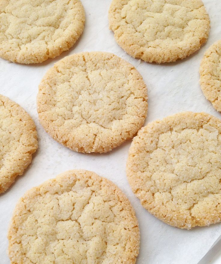 several cookies on a baking sheet ready to be baked