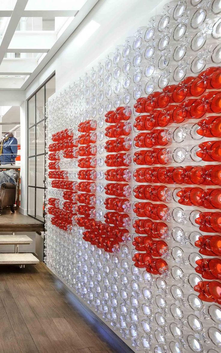 an office lobby with red and white letters on the wall