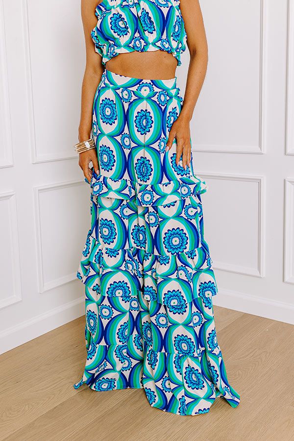 - Take on the tropics with this trendy skirt! Its abstract print and trendy beaded accents give it an island vibe. Bring a piece of paradise wherever you go with this playful skirt! - Unlined material with an abstract print featuring blues, greens, and ivory - A waistline with an elastic back and side zip closure - Ruffled detailing - A flowy silhouette that ends in a maxi length hemline Trendy Skirts, Floral Maxi Skirt, Island Vibes, Floral Maxi, Abstract Print, Side Zip, Oasis, Royal Blue, Maxi Skirt