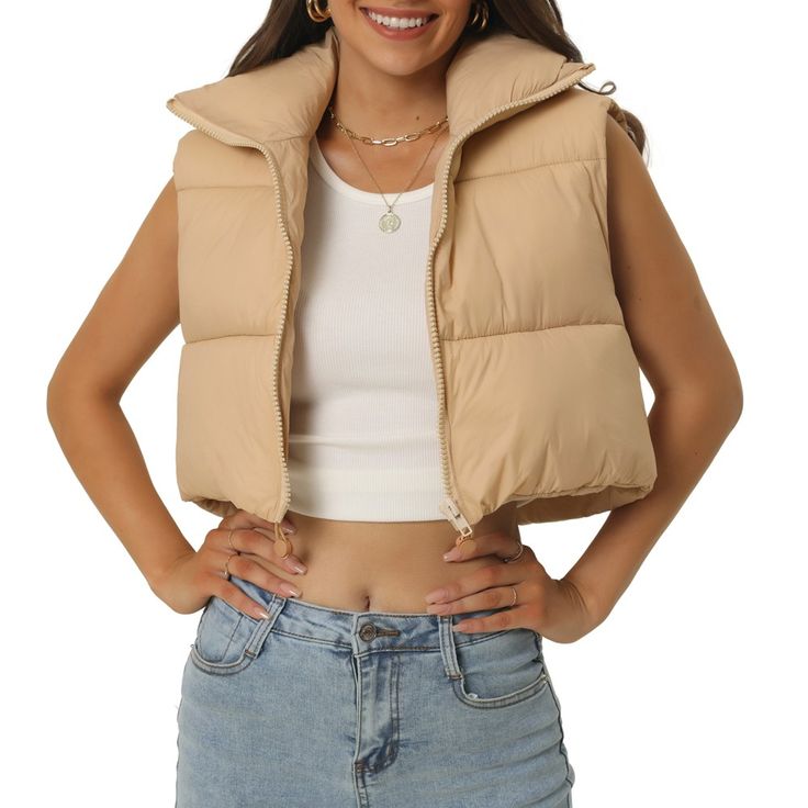 The winter cropped vests offer you multiple choices of colors. These nice quality puffer jackets must be a must-have for your wardrobes. Lightweight vest with puffy padding inside which is designed to keep you warm and comfy. Cropped puffer vests are a must-have in today's fashion, and can be worn with a crop sleeveless top/long sleeve shirt/sweater/hoodie/dresses for a casual look. High-quality zipper works smoothly. Adjustable drawing on the hem can shape a flattering fit. The padded cropped v Green Jean Jacket, Cropped Puffer Vest, Olive Green Vest, Puffer Vests, Hoodie Dresses, Crop Vest, Jacket Puffer, Padded Vest, Lightweight Vest