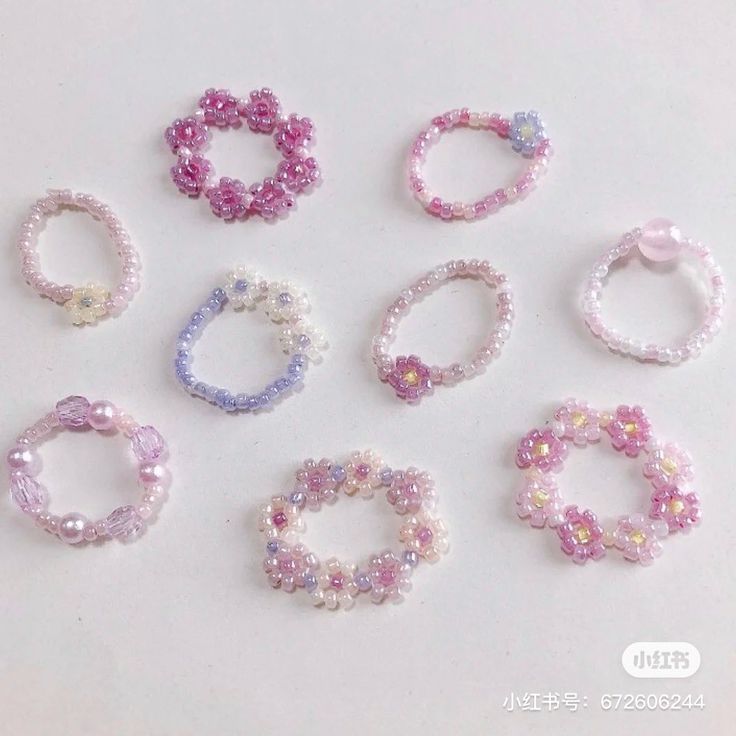 several different types of bracelets on a white surface