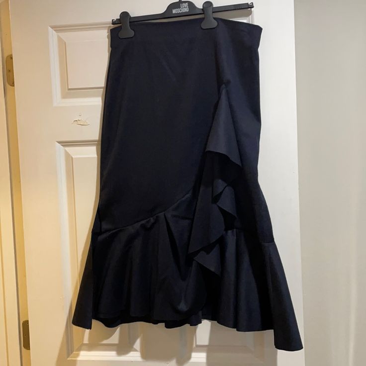 Navy Zara Fluted Ruffle Skirt. Never Worn. Nice Fabric And Great With Sweaters. Elegant Blue Maxi Skirt With Ruffles, Elegant Blue Ruffled Maxi Skirt, Elegant Zara Skirt With Ruffles, Elegant Ruffled Skirt By Zara, Ruffled Zara Skirt, Zara Ruffled Skirt, Zara Ruffled Party Bottoms, Zara Elegant Ruffled Skirt, Zara Skirts