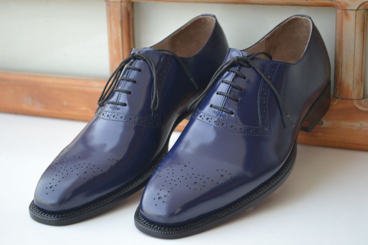 Handmade Premium Quality Leather Navy Blue Colour Oxford Wing Tip Brogue Men Shoes ❤ Upper Material👉 Genuine Calf Leather ❤ Inner Linings👉 Soft Leather ❤ Style👉 Oxford Wing Tip Brogue Men Shoes ❤ Colour👉 navy Blue ❤ Sole👉 Leather ❤ Gender👉 Male ❤ Heel👉 Leather ❤ Totally Hand stitched 👍 Manufacturing Time 12 to 14 Business Days Accessories may differ Sometime a little from original picture due to availability Coloured rubber out sole extends durability and longevity of these striking men's dress shoes LOAFER These comfortable slip-on shoes were invented at the turn of the 20th century and are considered offshoots of moccasins. The shaft of the loafer continues down under the length of the foot and is sealed on top with a vamp insert. Loafers also feature an out sole and a heel. CALF Classic Blue Leather Shoes For Work, Blue Plain Toe Oxfords For Business, Blue Wingtip Dress Shoes With Brogue Detailing, Blue Wingtip Dress Shoes For Business, Classic Blue Round Toe Oxfords, Blue Goodyear Welted Oxfords For Business, Business Blue Goodyear Welted Oxfords, Classic Blue Dress Shoes For Work, Blue Plain Toe Dress Shoes For Semi-formal Occasions