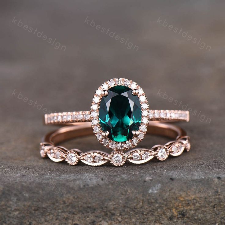 an oval cut green sapphire and diamond halo engagement ring set in rose gold with matching band