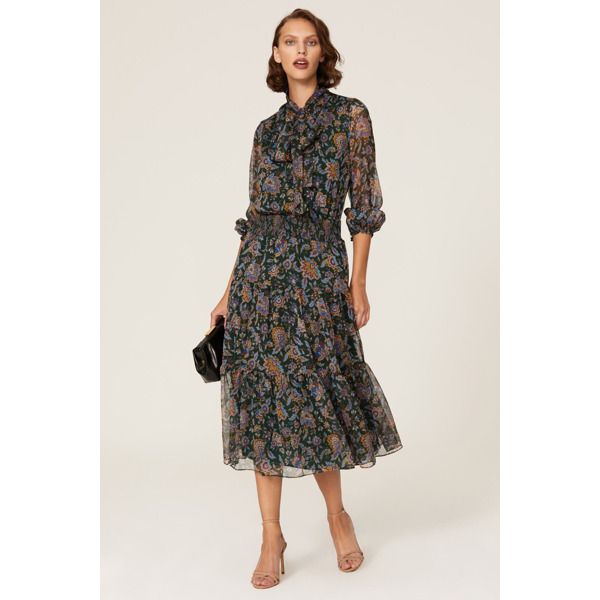 Floral printed crepe (100% Polyester). Blouson. Tie neck. Long sleeves. Tie closure. 52" from shoulder to hemline. Imported. Formal Fall Dresses With Blouson Sleeves, Flowy Paisley Print Midi Dress, Fall Workwear Dresses With Blouson Sleeves, Silk Midi Dress With Floral Print For Work, Elegant Patterned Printed Dress, Long Sleeve Printed Formal Dresses, Formal Printed Long Sleeve Dresses, Formal Long Sleeve Printed Dress, Elegant Spring Midi Dress With Paisley Print