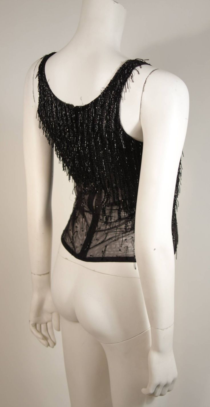 Versace Atelier Beaded Black Mesh Evening Top Size Small | From a collection of rare vintage shirts at https://www.1stdibs.com/fashion/clothing/shirts/ Stretch Beaded Top For Party, Glamorous Sequined Mesh Top For Evening, Embellished Stretch Mesh Party Top, Embellished Stretch Mesh Top For Party, Stretch Sequin Mesh Top For Evening, Stretch Mesh Top With Sequins For Evening, Embellished Stretch Mesh Top For Evening, Elegant Fitted Sequin Mesh Top, Elegant Sleeveless Mesh Top For Evening