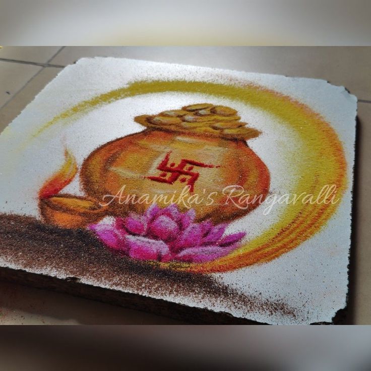 a painting on the ground with flowers and a gold pot in it's center