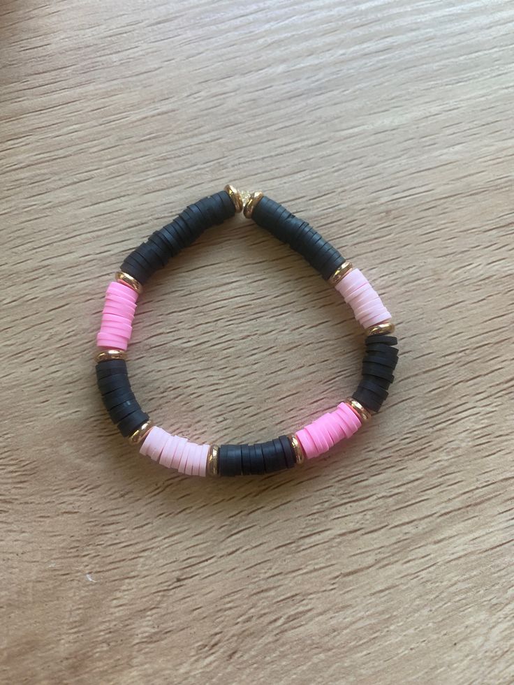 Allison pink is a pretty pink and black black bracket with a bit of gold that was named after one of my munchkins, Allison and just like her it's a fun and enjoyable bracelet that many people will like! This bracelet is also handmade and will fit teenagers and kids wrist comfortably. Cute Black Beaded Bracelets For Friendship, Black And Pink Bracelet, Trendy Black Handmade Stretch Bracelet, Trendy Handmade Black Stretch Bracelet, Cute Black Friendship Bracelets, Cute Adjustable Black Friendship Bracelets, Cute Black Bracelet Jewelry, Bracelet Perle Plate, Pink Clay Bead Bracelet