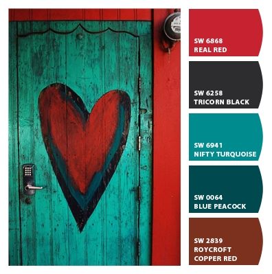 a heart painted on the front door of a house with red, blue and green paint