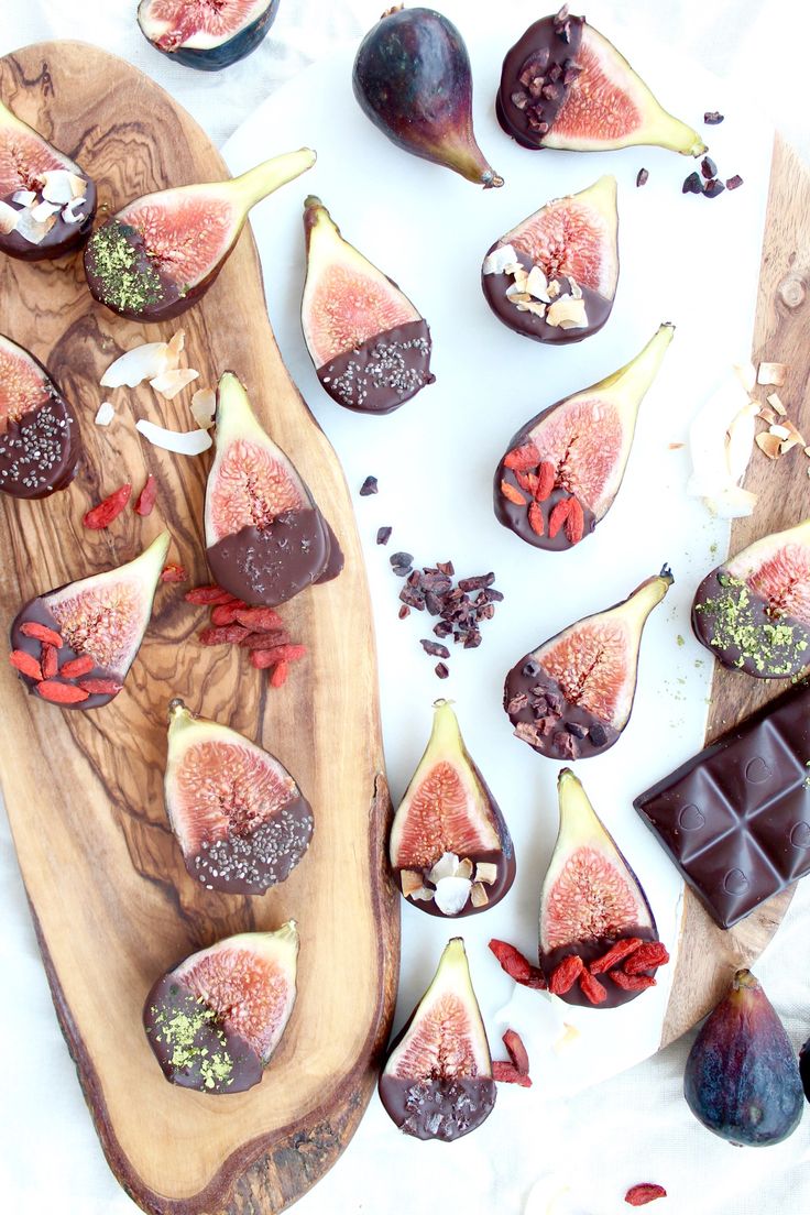 sliced figs and chocolate on a cutting board