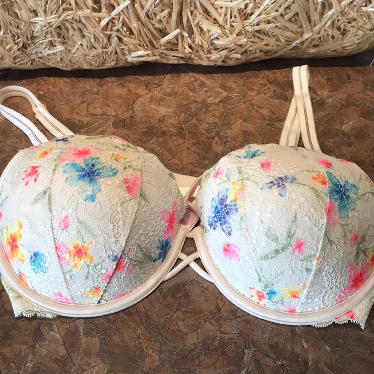 Pink Victoria’s Secret Date Push Up Bra. This Sexy Bra Has Lace And Flower Designs On The Cups With A Cute Crisscross Design In The Front. Inside Pink Colored Cups With Adjustable Straps And Back. New Without Tags Size 36dd. Adorable Spring Push-up Bra With Padded Cups, Spring Push-up Bra, Spring Underwire Bra With Straps, Feminine Spring Bra With Floral Print, Spring Feminine Bra With Floral Print, Feminine Floral Print Bra For Spring, Feminine Spring Floral Print Bra, Spring Feminine Floral Print Bra, Spring Floral Print Multicolor Bra