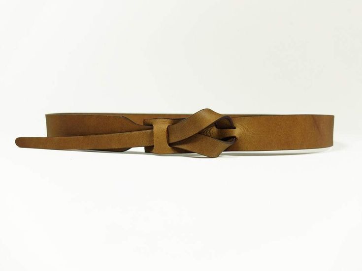 A versatile buckle-less belt, good for looping through your favorite pair of jeans or accessorizing your favorite dress. Handmade with vegetable tanned leather in Peru. ﻿Please note: Belt color may vary slightly due to hide tanning. 1" wide belt. To find your size: Measure your body at the spot you would like to wear the belt (this could be at your natural waist, low on the hips, towards the top of your ribcage, or anywhere in between!); your usual waist measurement may not work if you are plann Adjustable Brown Belt, Adjustable Brown Belt With Self Belt Detail, Everyday Brown Belt Buckles With Belt Included, Casual Brown Adjustable Belt, Casual Adjustable Brown Belts And Suspenders, Hide Tanning, Dress Handmade, Wide Belt, Rib Cage